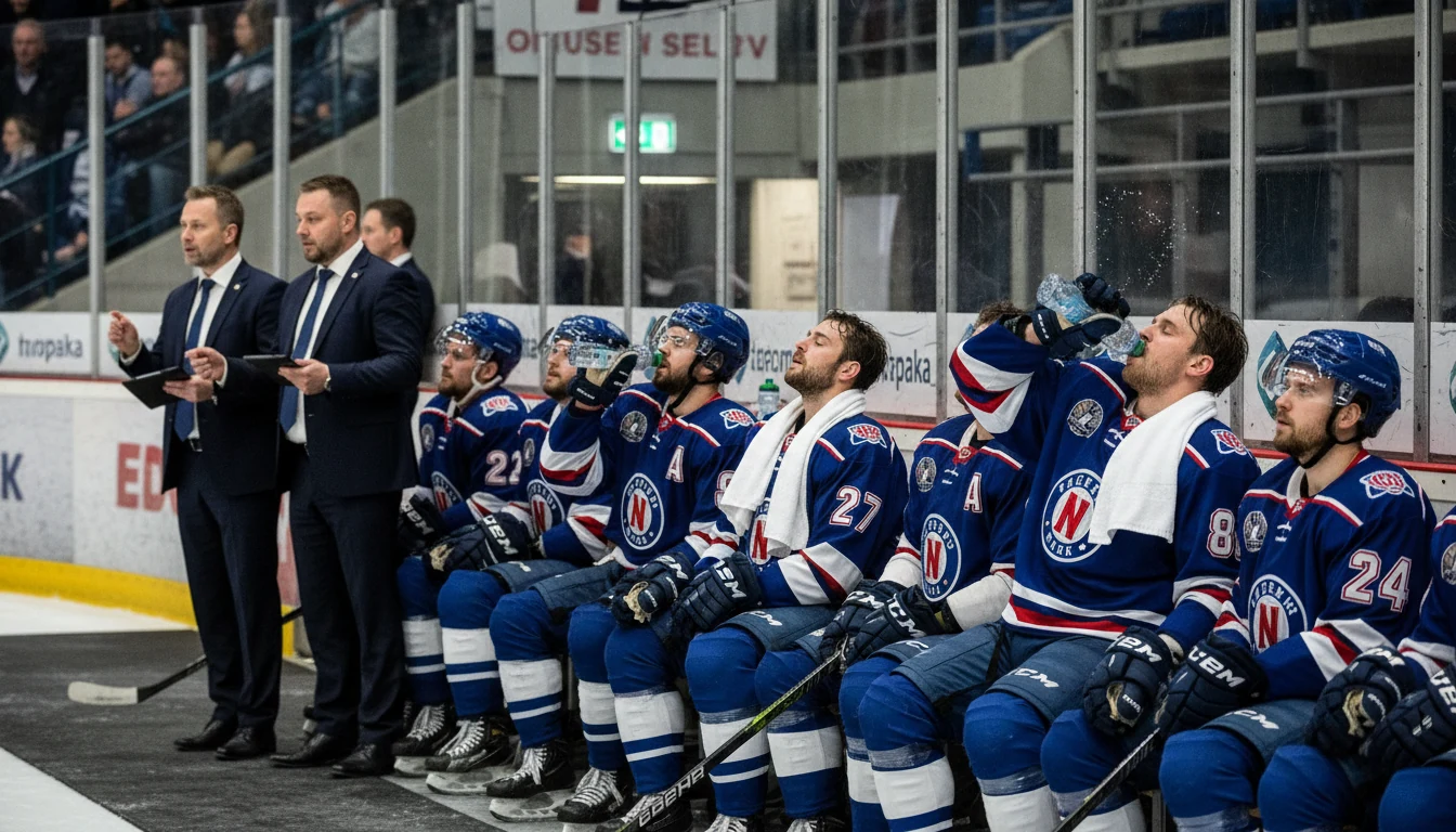 Hockey players resting on bench showing signs of game fatigue
